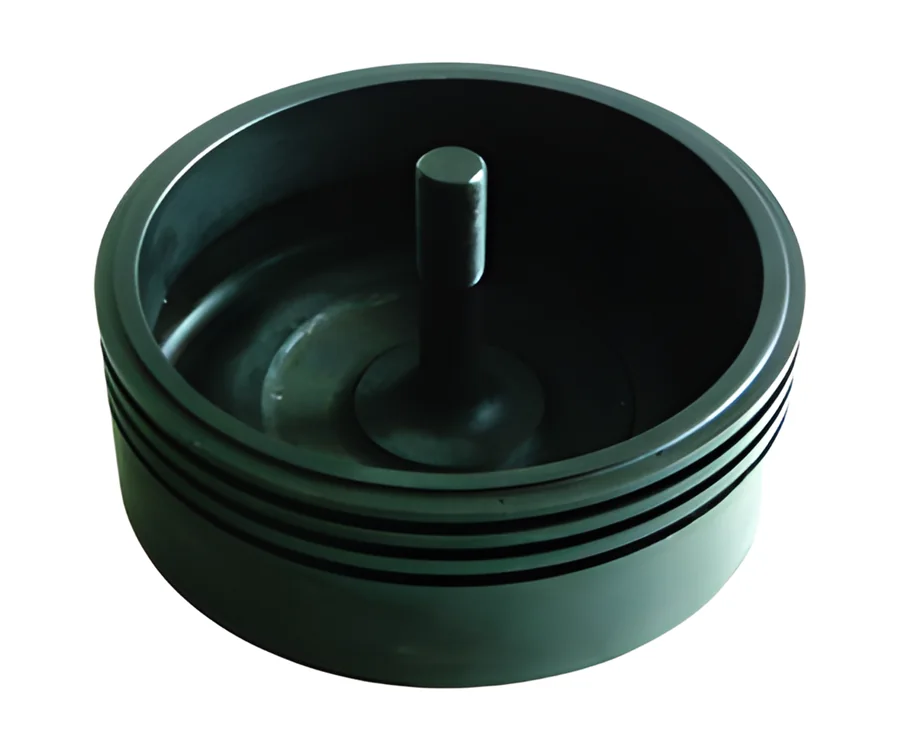 Black piston crown with a centre pin and ring grooves
